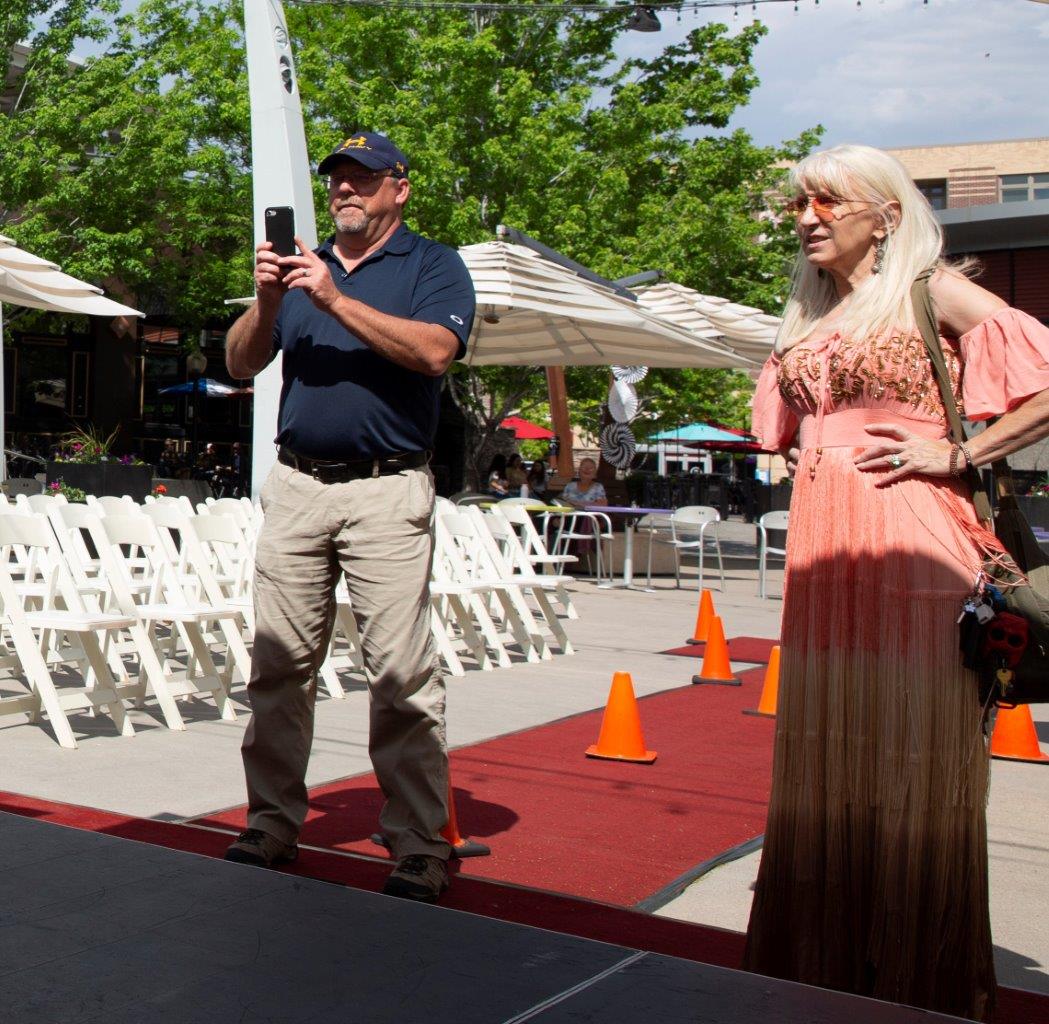 Jeanie Kochis, Colorado Miss Amazing Event partner sets up signage and more